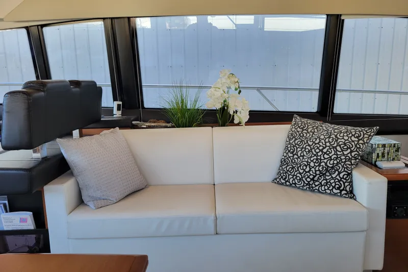 Slide: The Image of Luxurious interior of 2017 Prestige 500 yacht with elegant sofa and decorative pillows. - 15