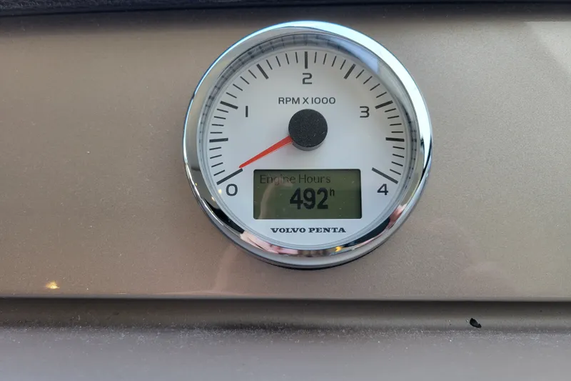 Slide: The Image of Volvo Penta RPM gauge showing 492 engine hours on a 2017 Prestige 500. - 20