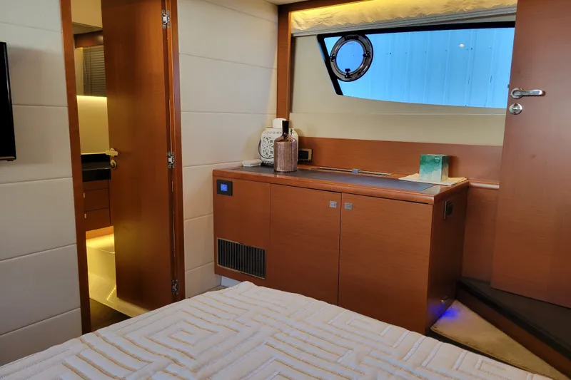 Slide: The Image of Luxurious interior of a 2017 Prestige 500 yacht, featuring elegant wood cabinetry and modern design. - 38