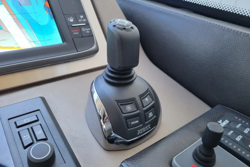 Slide: The Image of Joystick control panel on a 2017 Prestige 500 yacht, featuring navigation and docking controls. - 24
