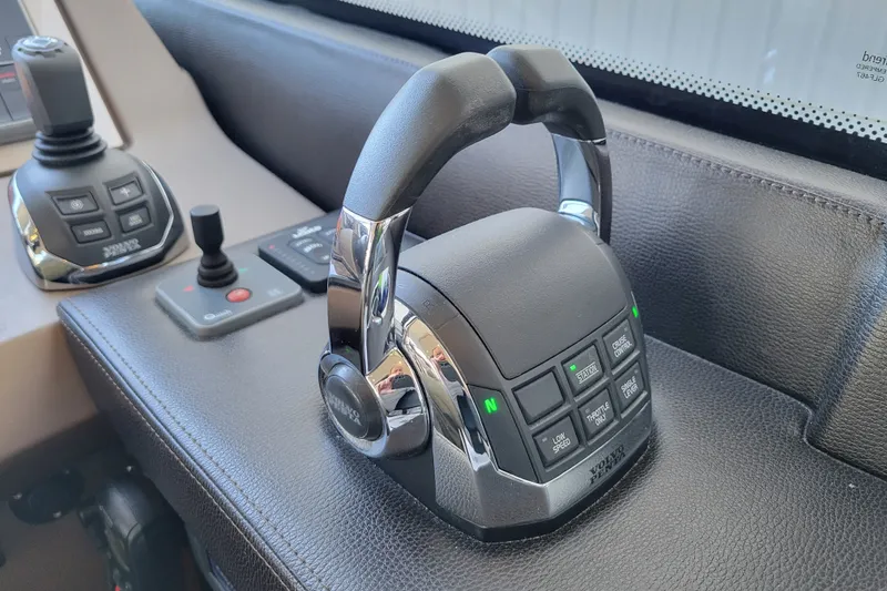 Slide: The Image of Control panel of a 2017 Prestige 500 yacht with joystick and throttle controls. - 26