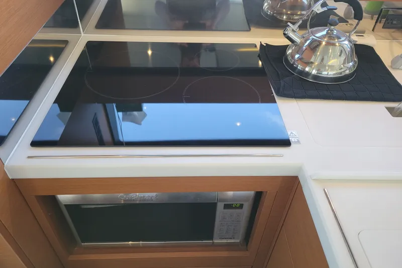 Slide: The Image of Modern kitchen in 2017 Prestige 500 yacht with stovetop and microwave. - 42