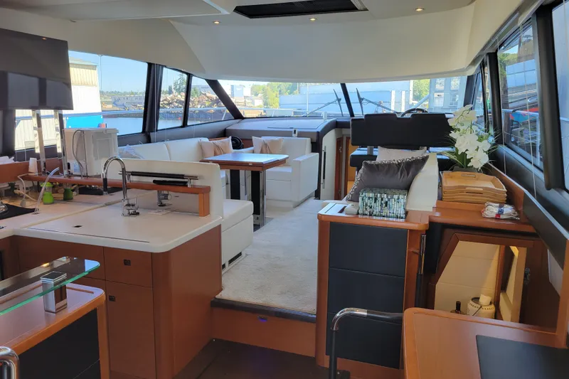 Slide: The Image of Luxurious interior of a 2017 Prestige 500 yacht with modern furnishings and panoramic windows. - 10