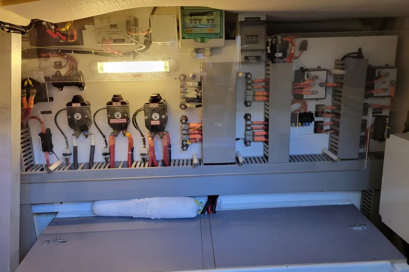 Slide: The Image of Electrical panel inside a 2017 Prestige 500 yacht, showcasing wiring and components. - 56