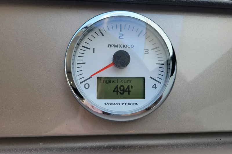 Slide: The Image of Volvo Penta RPM gauge showing 494 engine hours on Prestige 500, 2017 model. - 21