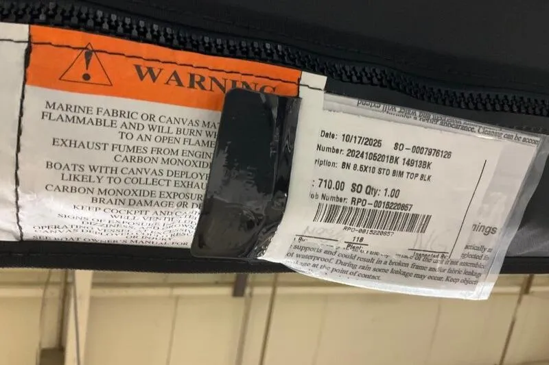 Slide: The Image of Warning label on Bennington 23 SX L-Bench, 2026 model, highlighting flammability and carbon monoxide risks. - 10