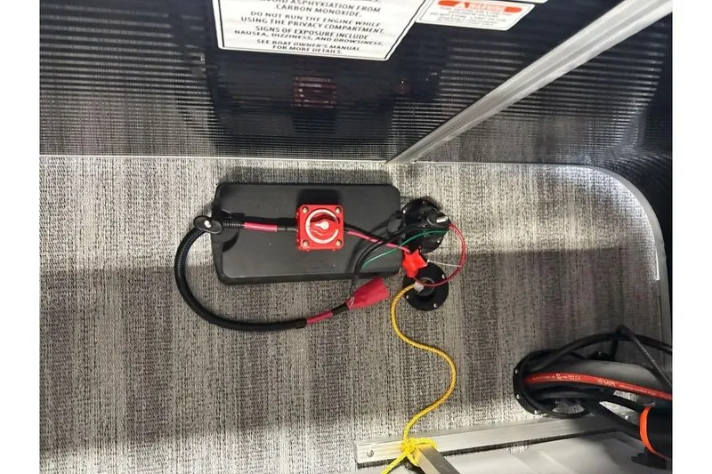 Slide: The Image of Electrical wiring setup in a 2026 Bennington 23 SX L-Bench boat compartment. - 11