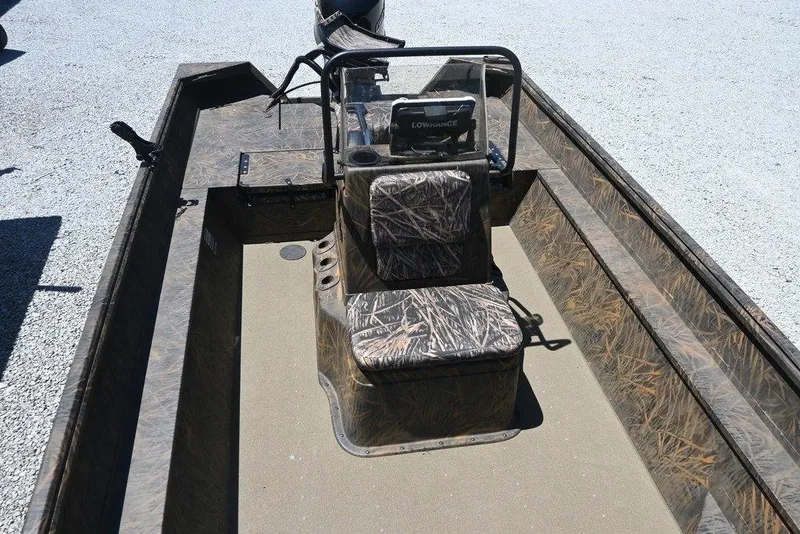 Slide: The Image of 2025 G3 Gator Tough 20 CC boat interior with camouflage seating and console. - 3