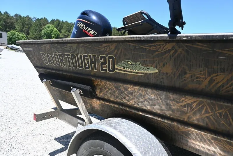 Slide: The Image of 2025 G3 Gator Tough 20 CC boat on trailer, featuring camouflage design and Yamaha motor. - 8