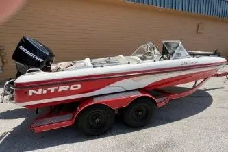 The Image of 2006 Nitro 288 Sport boat with Mercury engine on a trailer. - 0