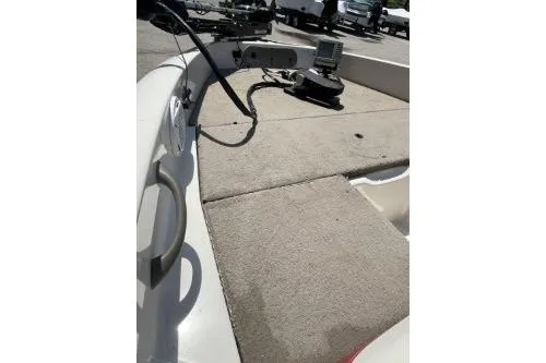 Slide: The Image of 2006 Nitro 288 Sport boat deck with mounted equipment in a parking area. - 5