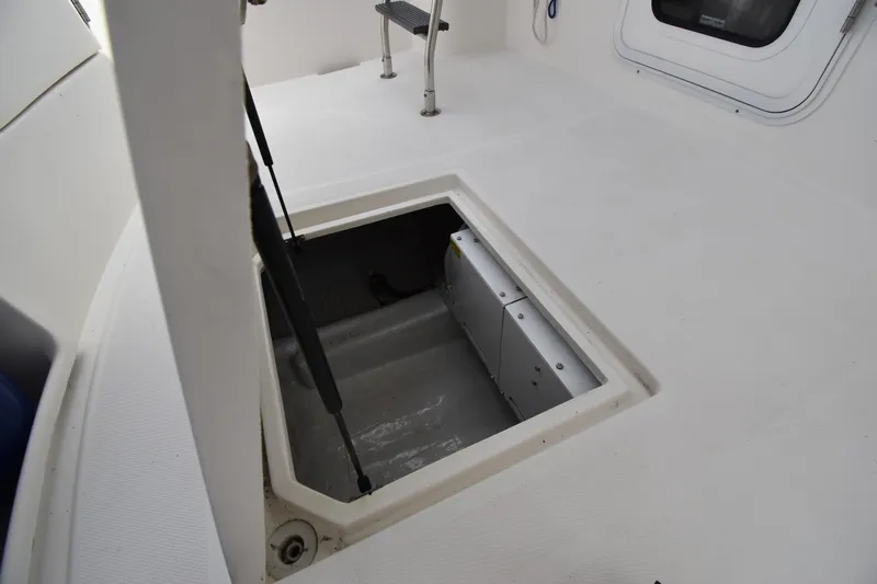 Slide: The Image of Open hatch on 2007 Nordic Tug 37 boat deck, revealing storage compartment. - 11