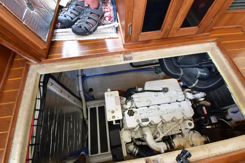 Slide: The Image of Engine compartment of a 2007 Nordic Tug 37, featuring a Cummins engine. - 23