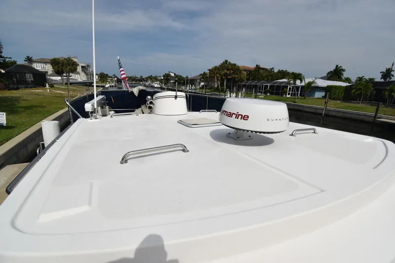Slide: The Image of 2007 Nordic Tug 37 boat with Raymarine radar on deck, docked in a canal. - 5