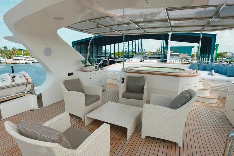 Slide: The Image of Luxurious 2008 Benetti Classic yacht deck with seating and jacuzzi, docked at marina. - 10
