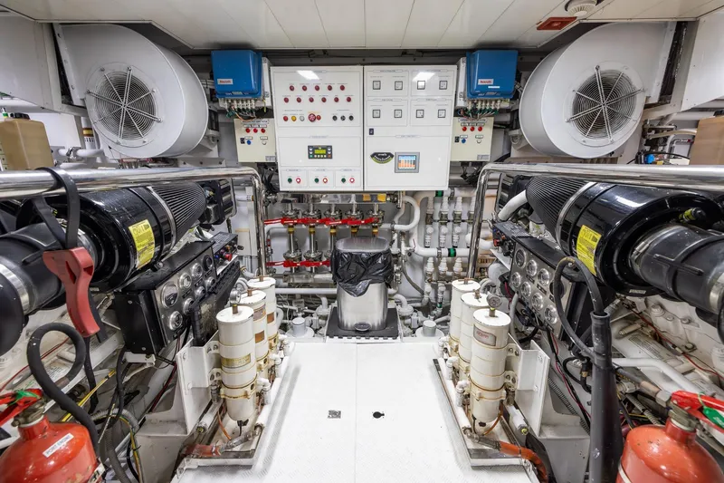 Slide: The Image of Engine room of a 2008 Benetti Classic yacht, featuring control panels and machinery. - 103