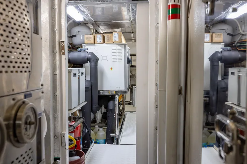 Slide: The Image of Engine room of a 2008 Benetti Classic yacht, showcasing machinery and equipment. - 106