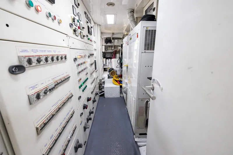 Slide: The Image of Engine room of a 2008 Benetti Classic yacht with control panels and equipment. - 107