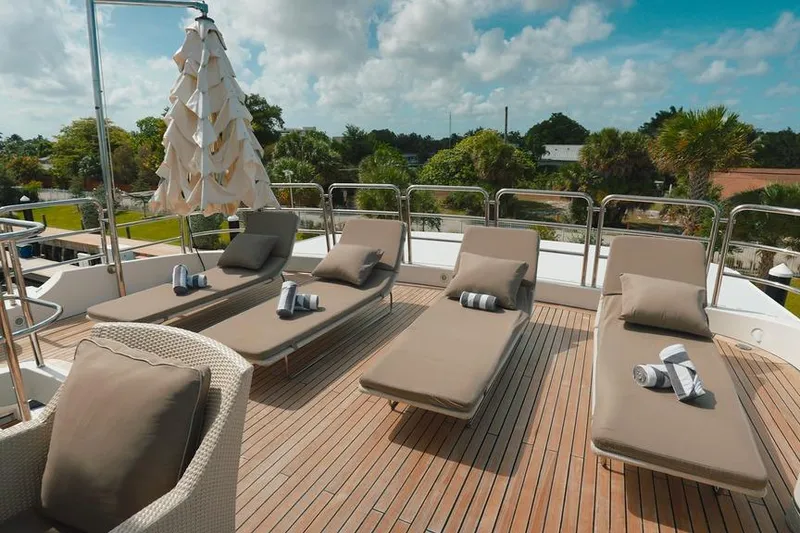 Slide: The Image of Sun deck of 2008 Benetti Classic yacht with loungers and umbrella. - 13