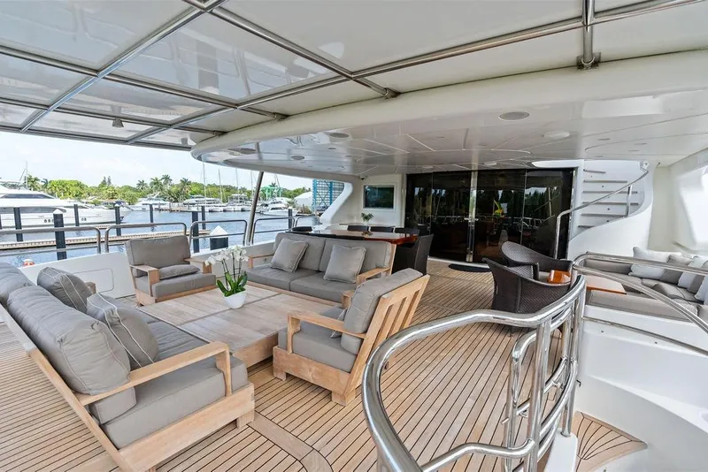 Slide: The Image of Luxurious 2008 Benetti Classic yacht deck with elegant seating and scenic marina view. - 15
