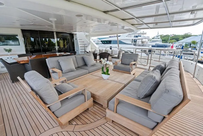 Slide: The Image of Luxurious 2008 Benetti Classic yacht deck with elegant seating and dining area. - 16
