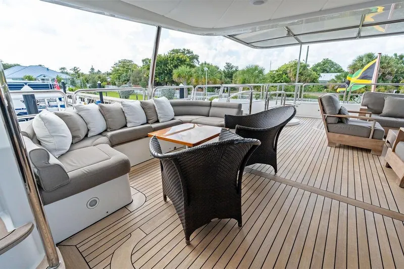 Slide: The Image of Luxurious 2008 Benetti Classic yacht deck with elegant seating and wooden flooring. - 17