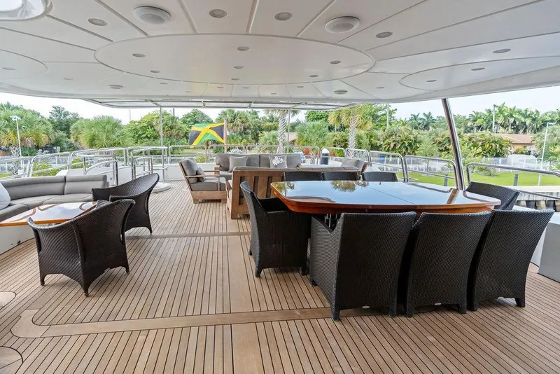 Slide: The Image of Luxurious 2008 Benetti Classic yacht deck with elegant seating and dining area. - 19