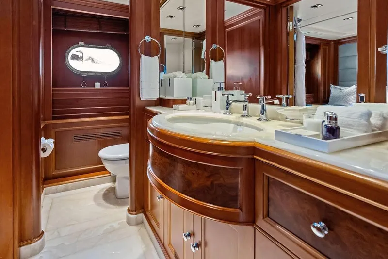 Slide: The Image of Luxurious bathroom on 2008 Benetti Classic yacht with elegant wood finishes and dual sinks. - 29