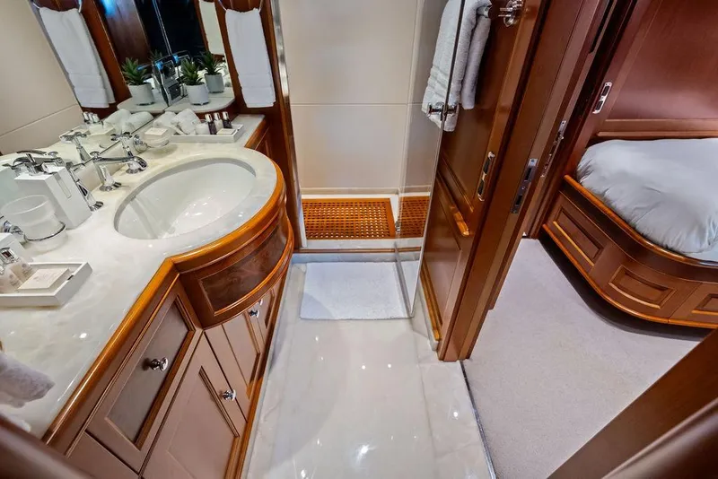 Slide: The Image of Luxurious bathroom interior on a 2008 Benetti Classic yacht, featuring elegant wood and marble finishes. - 30