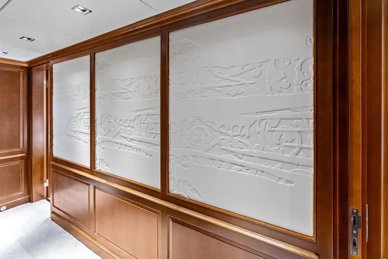 Slide: The Image of Luxurious wood paneling with intricate designs on a 2008 Benetti Classic yacht interior. - 32
