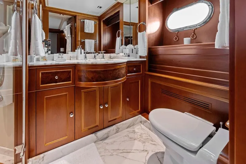 Slide: The Image of Luxurious bathroom on 2008 Benetti Classic yacht with elegant wood cabinetry and marble flooring. - 35