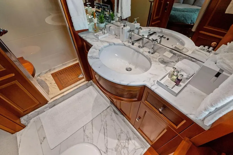 Slide: The Image of Luxurious bathroom on 2008 Benetti Classic yacht with marble countertops and elegant fixtures. - 36