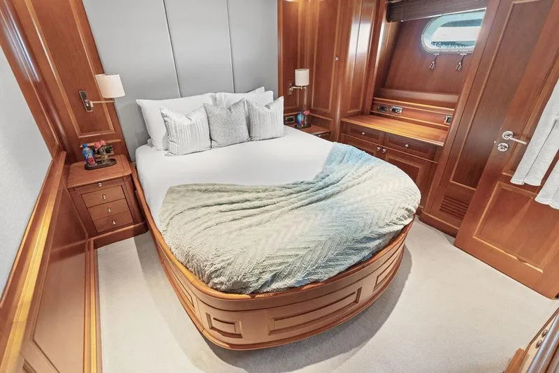 Slide: The Image of Luxurious 2008 Benetti Classic yacht bedroom with elegant wood paneling and cozy bedding. - 37