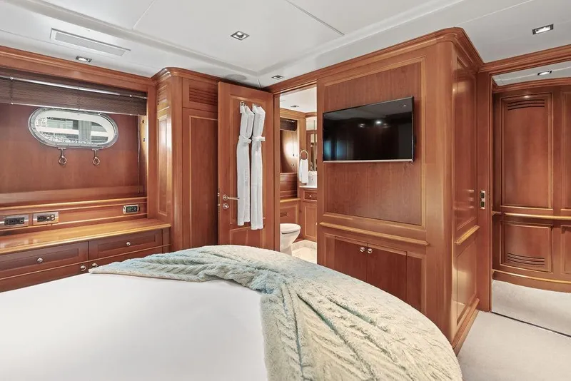 Slide: The Image of Luxurious 2008 Benetti Classic yacht bedroom with elegant wood paneling and modern amenities. - 38