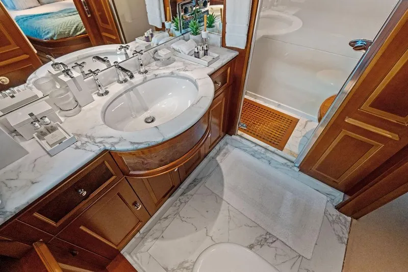 Slide: The Image of Luxurious bathroom in a 2008 Benetti Classic yacht with marble countertop and elegant fixtures. - 40