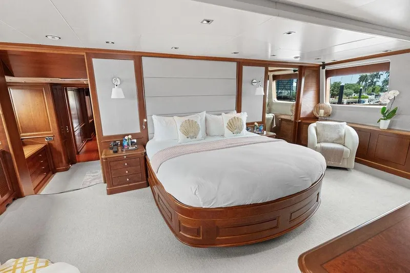 Slide: The Image of Luxurious 2008 Benetti Classic yacht bedroom with elegant wood finishes and large windows. - 45
