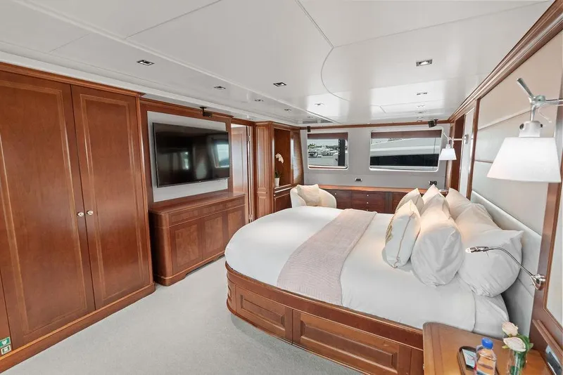 Slide: The Image of Luxurious 2008 Benetti Classic yacht bedroom with elegant wood finishes and modern amenities. - 46