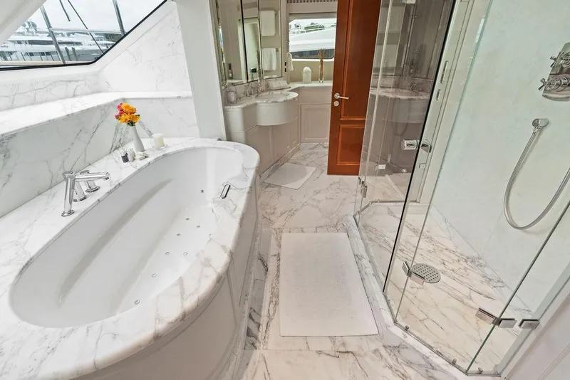 Slide: The Image of Luxurious marble bathroom on 2008 Benetti Classic yacht with bathtub and glass shower. - 49