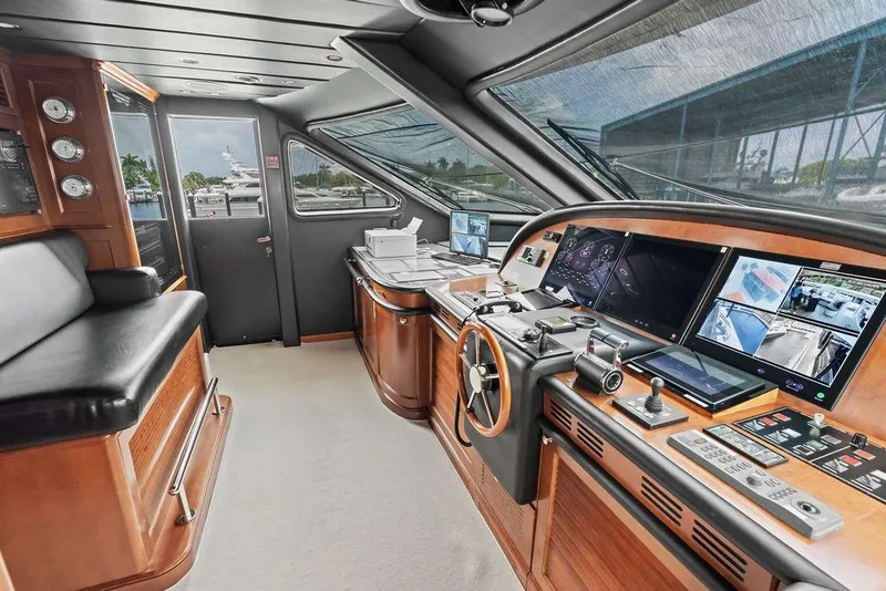 Slide: The Image of Luxurious 2008 Benetti Classic yacht helm with advanced navigation systems and elegant wood finish. - 57