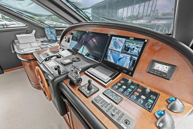 Slide: The Image of Control panel of a 2008 Benetti Classic yacht with advanced navigation systems. - 58