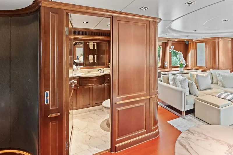 Slide: The Image of Luxurious interior of a 2008 Benetti Classic yacht featuring elegant wood paneling and plush seating. - 59