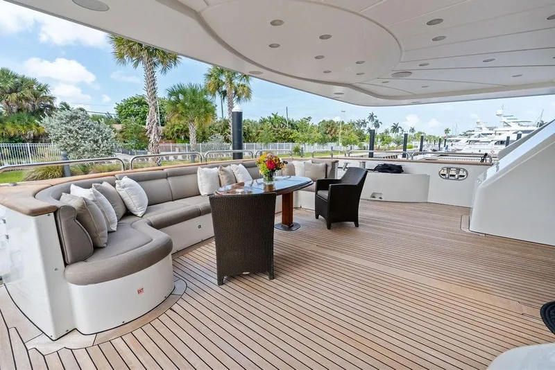 Slide: The Image of Luxurious 2008 Benetti Classic yacht deck with elegant seating and tropical views. - 7