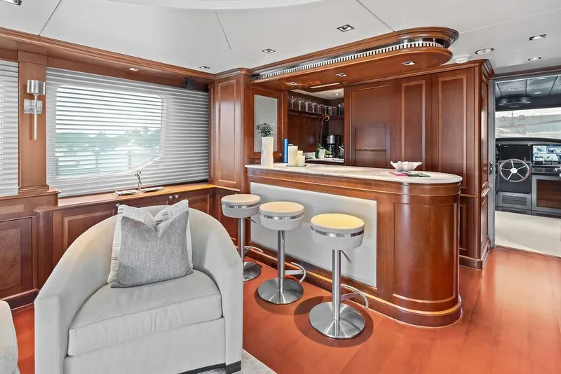Slide: The Image of Luxurious 2008 Benetti Classic yacht interior with elegant wood paneling and modern bar area. - 72