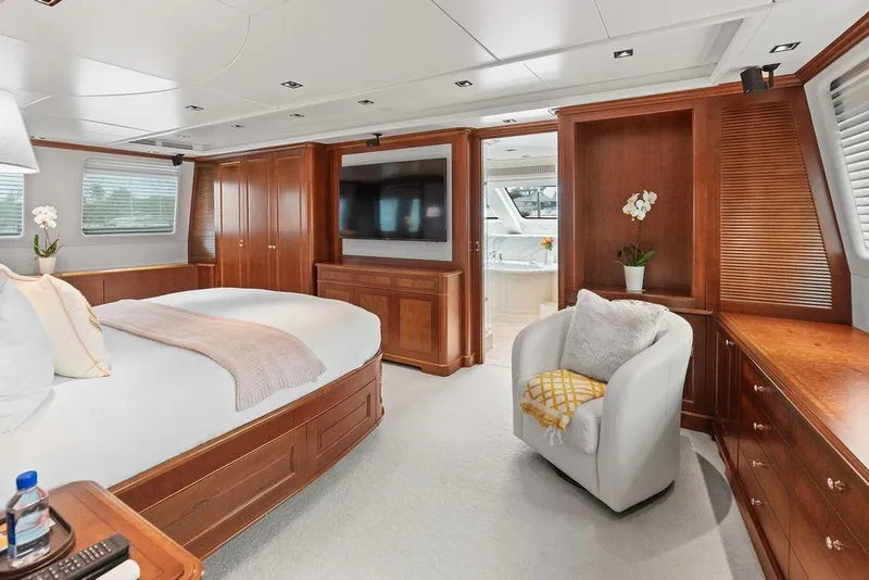 Slide: The Image of Luxurious 2008 Benetti Classic yacht bedroom with elegant wood furnishings and modern amenities. - 77