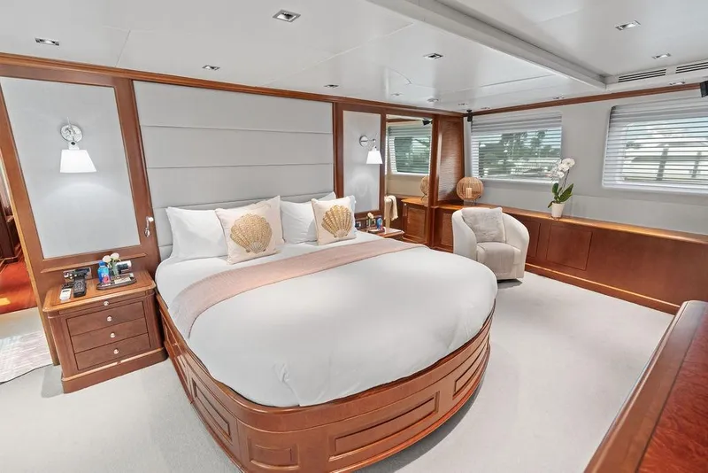 Slide: The Image of Luxurious bedroom interior on a 2008 Benetti Classic yacht, featuring elegant wood finishes. - 79