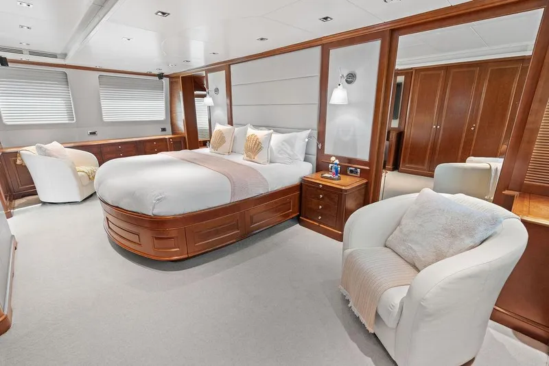 Slide: The Image of Luxurious 2008 Benetti Classic yacht bedroom with elegant wood furnishings and plush seating. - 80