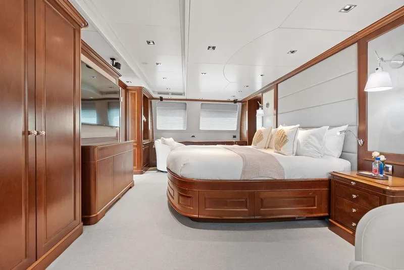 Slide: The Image of Luxurious 2008 Benetti Classic yacht bedroom with elegant wood furnishings and plush bedding. - 81