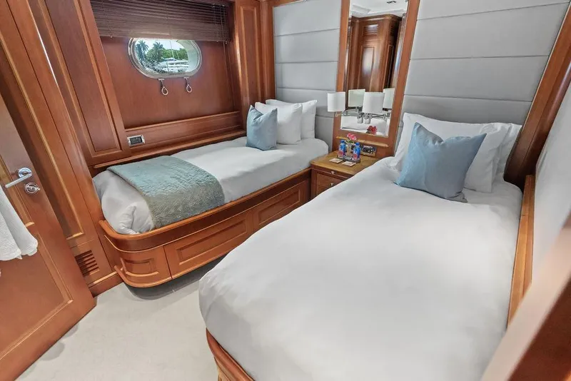 Slide: The Image of Luxurious 2008 Benetti Classic yacht cabin with twin beds and elegant wood paneling. - 82