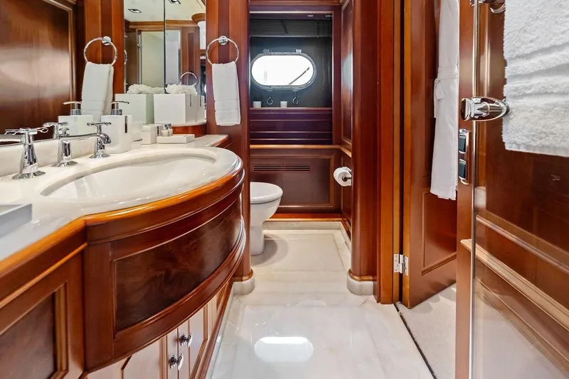 Slide: The Image of Luxurious bathroom in a 2008 Benetti Classic yacht with elegant wood finishes and modern fixtures. - 86