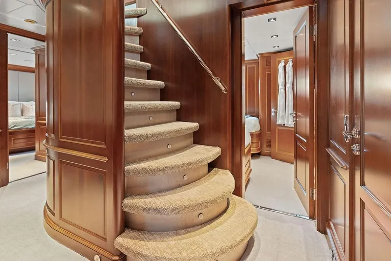 Slide: The Image of Luxurious interior of 2008 Benetti Classic yacht featuring elegant wooden staircase and plush carpeting. - 87